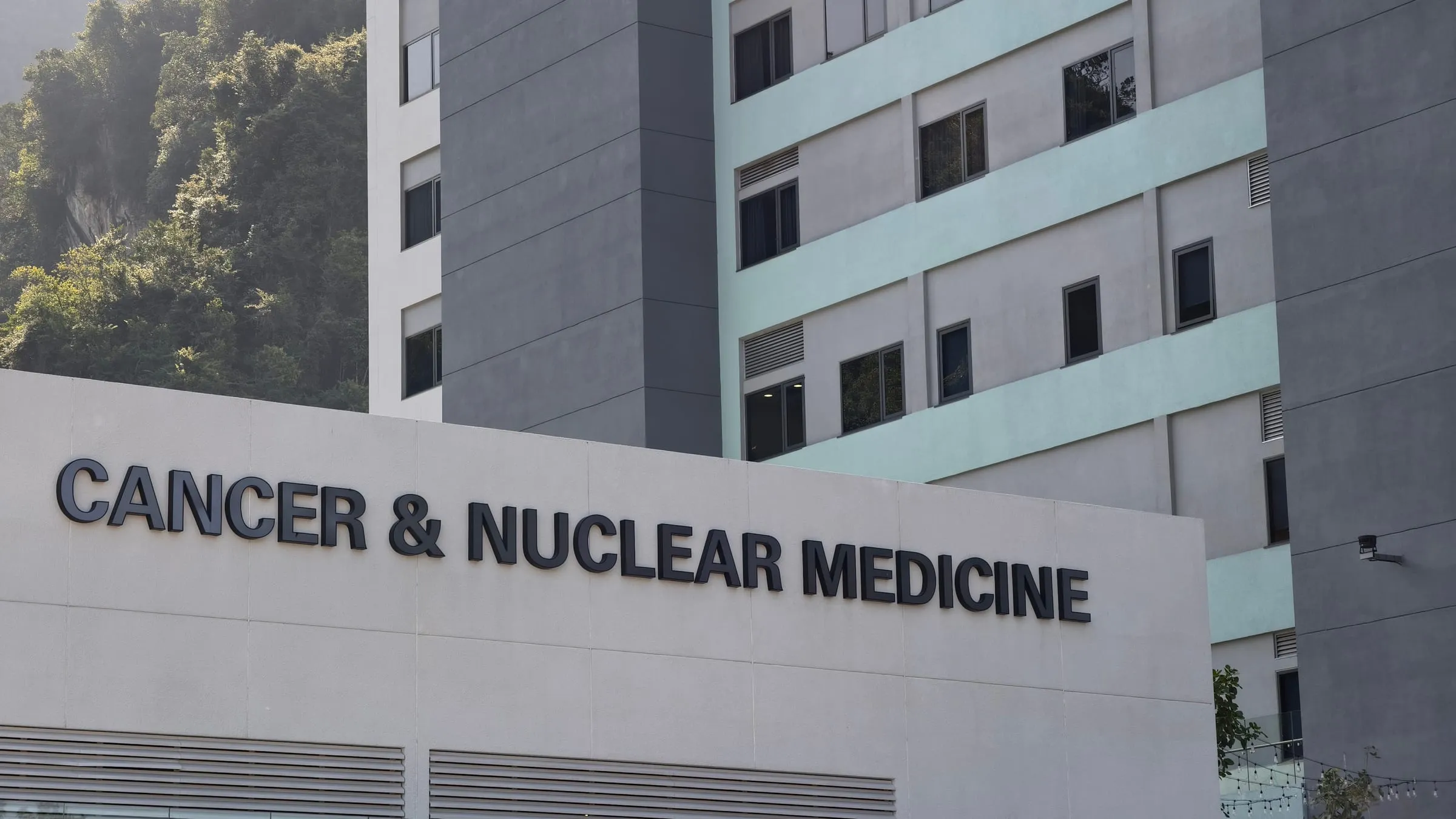 The exterior signage of a hospital cancer and nuclear-medicine center.