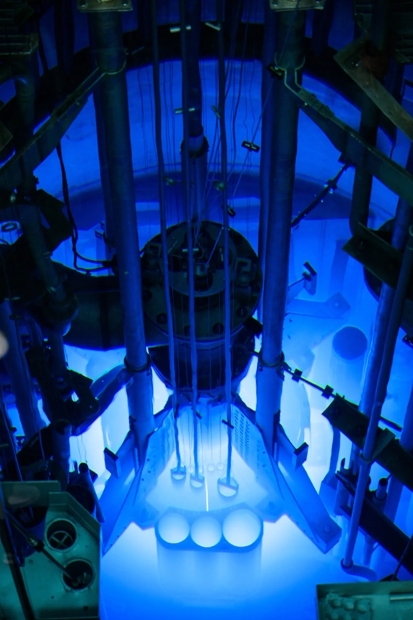 The Cherenkov-blue core of a research reactor, where medical isotopes are produced — illustrative isotope-production physics, not a FabUTech facility.